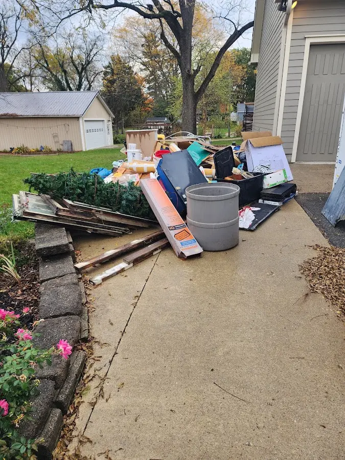 Dumpster being loaded with debris for Residential Dumpster Rental in Dallastown